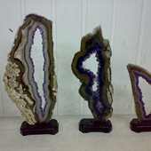 Uruguay Minerals. Marcos Lorenzelli S.R.L. Amethyst Geodes Slices with Wood Bases